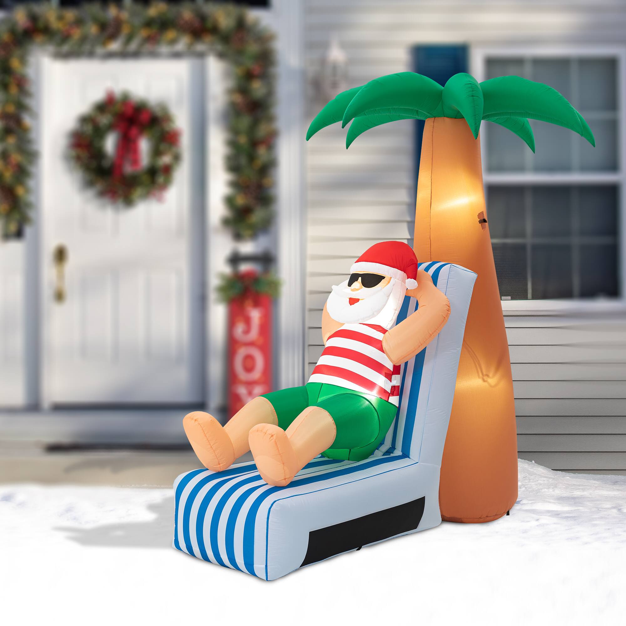 Glitzhome® 6ft. LED Lighted Santa Under Coconut Tree Inflatable Décor